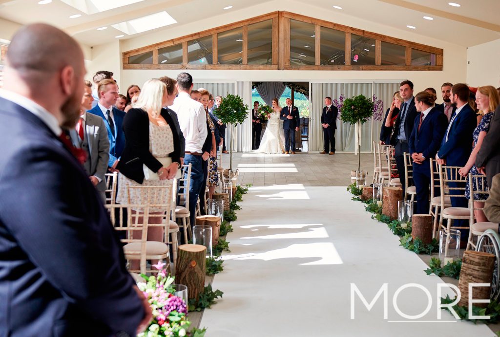 Ladywood Estate rustic wedding with white carpet aisle